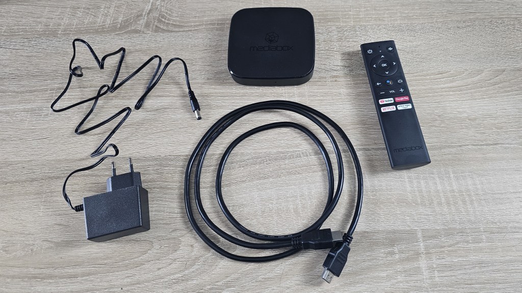 maverick streaming box with cables and remote